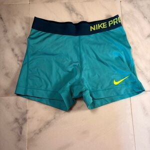 Nike Pro Teal Athletic Compression Shorts with Yellow Swoosh